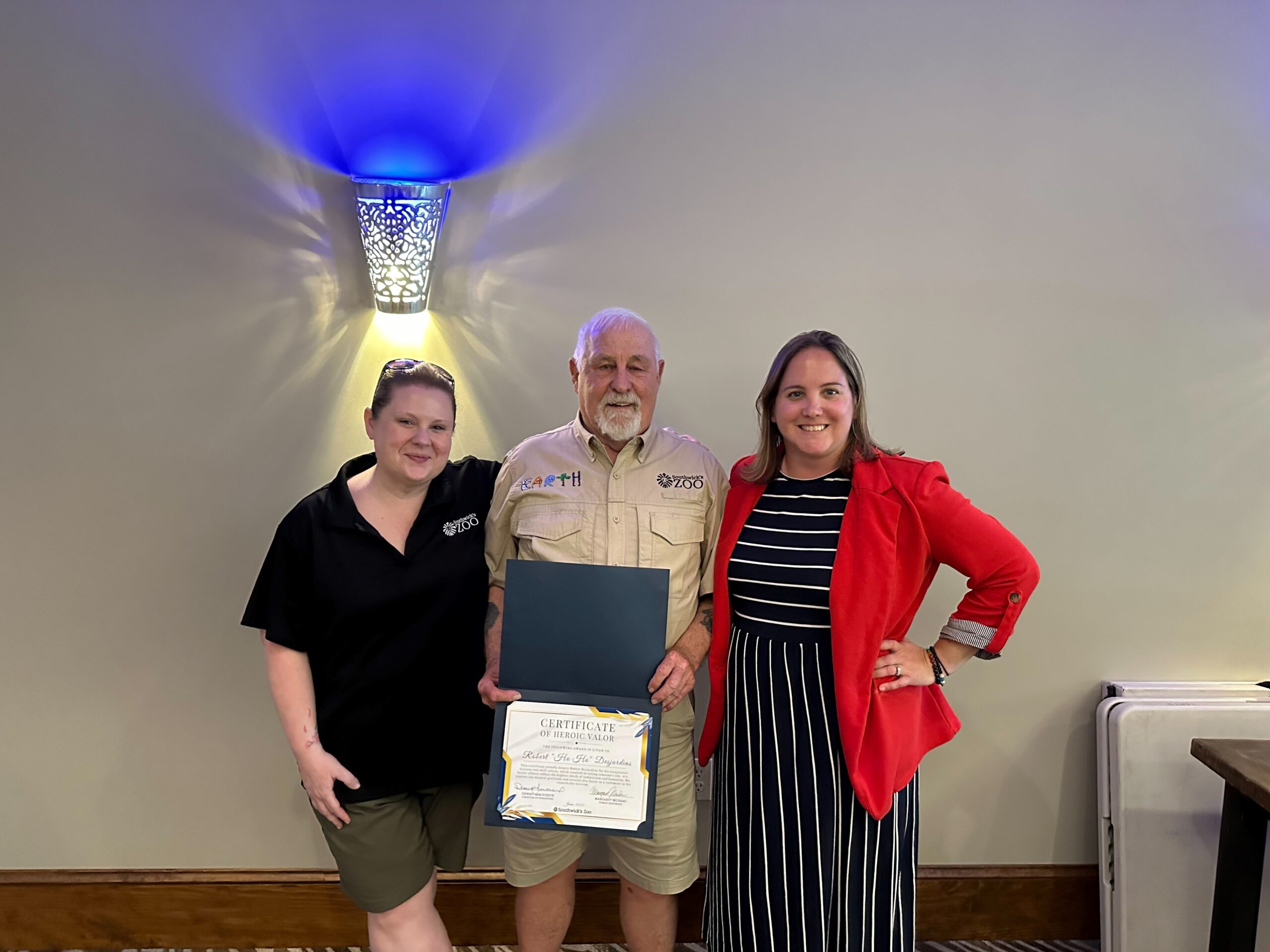 hoho Bob holding the certificate of heroic valor he was awarded.